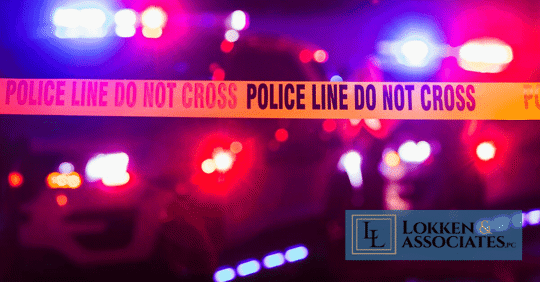 Police tape and police cars