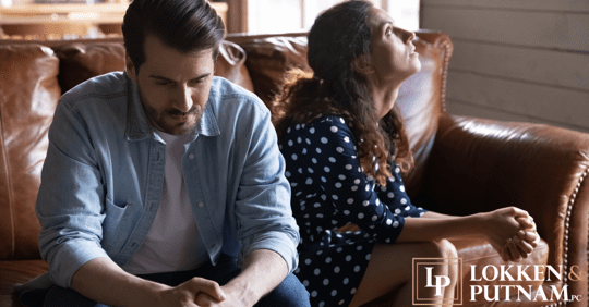 couple sitting facing away from each other